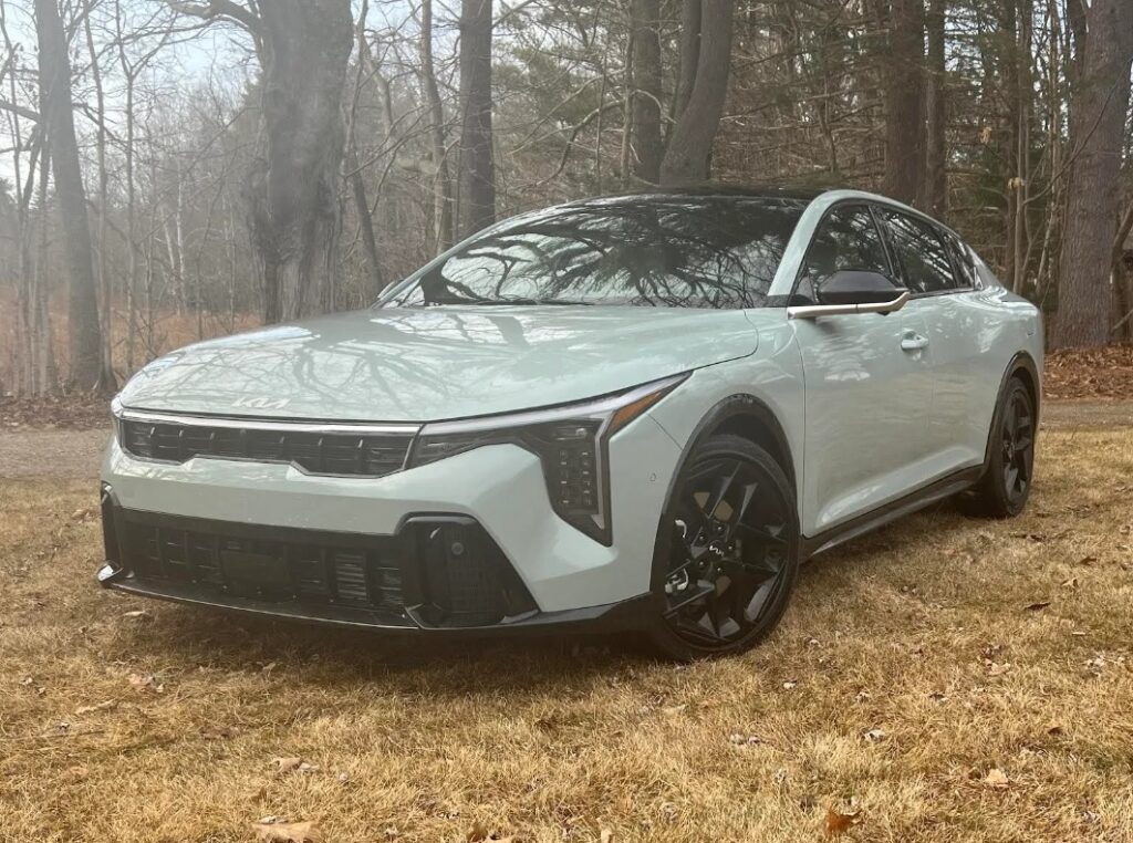Kia's 2025 K4 GT Line looks brilliant in morning fog.