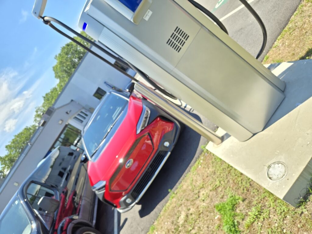 2025 Subaru Solterra charges on a Ford dealership's ChargePoint charger. 